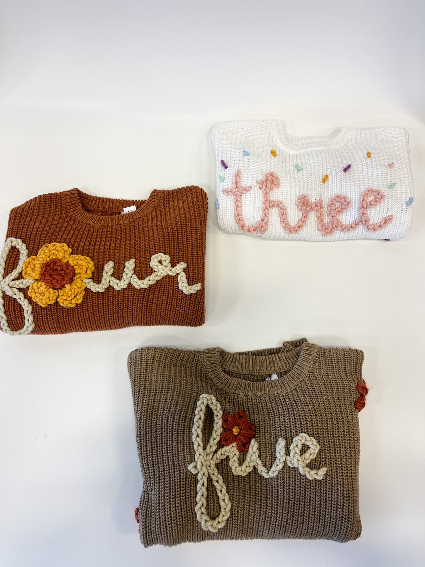 "Three" Embroidered Knit Sweater