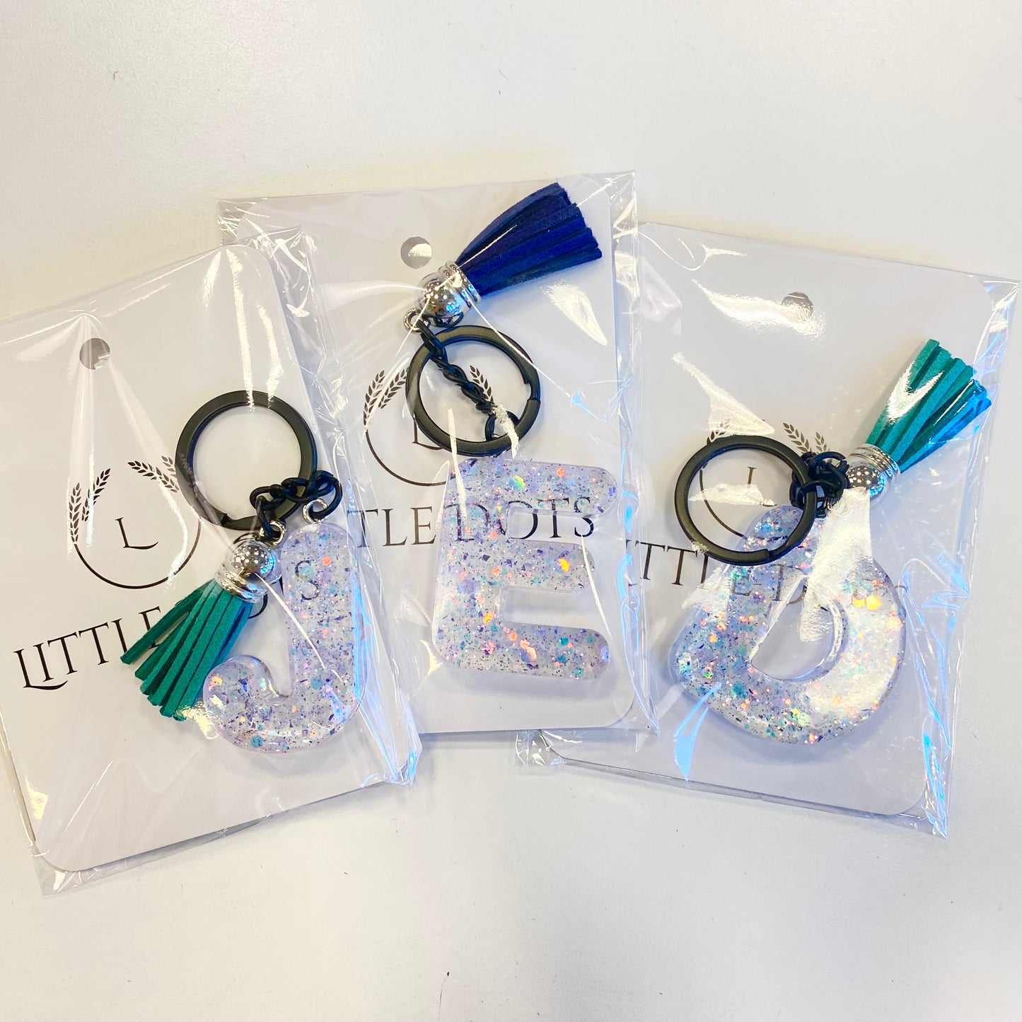 Initial Keychains in Clear with Blue Sparkle
